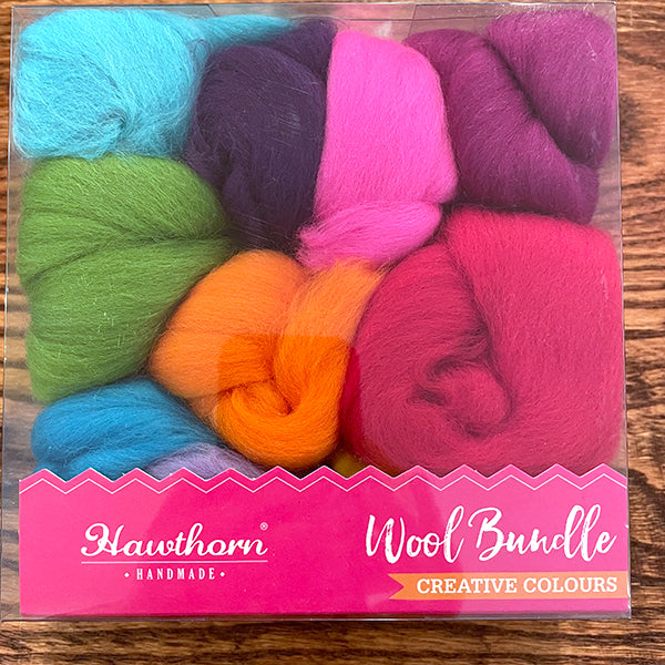 Hawthorn Handmade Wool bundle in multiple vibrant colors: light blue, dark purple, hot pink, green, orange, magenta, blue, light purple, orchid purple, and yellow
