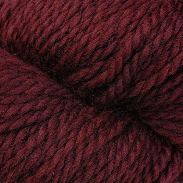 Detail of Berroco Mercado Chili 4155 a dark red with brown undertones. 
