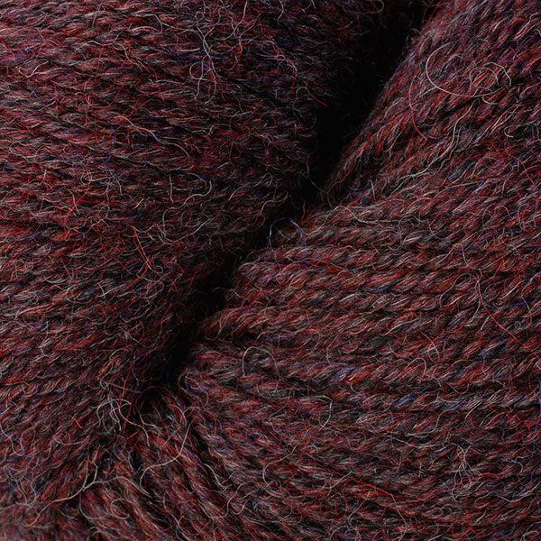 Detail of Berroco Ultra Alpaca in Lobster Mix 6297, a heathered dark maroon.