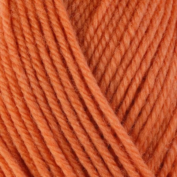 Detail of Berroco Ultra Wool Bittersweet 3328, a bright pinkish orange. 