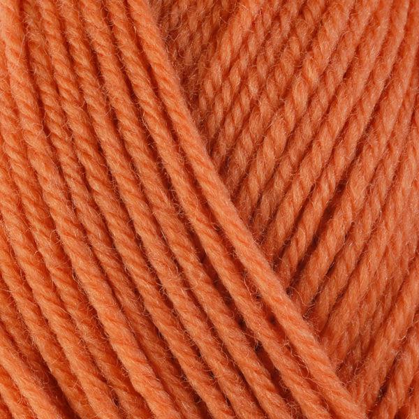 Detail of Berroco Ultra Wool Bittersweet 3328, a bright pinkish orange. 