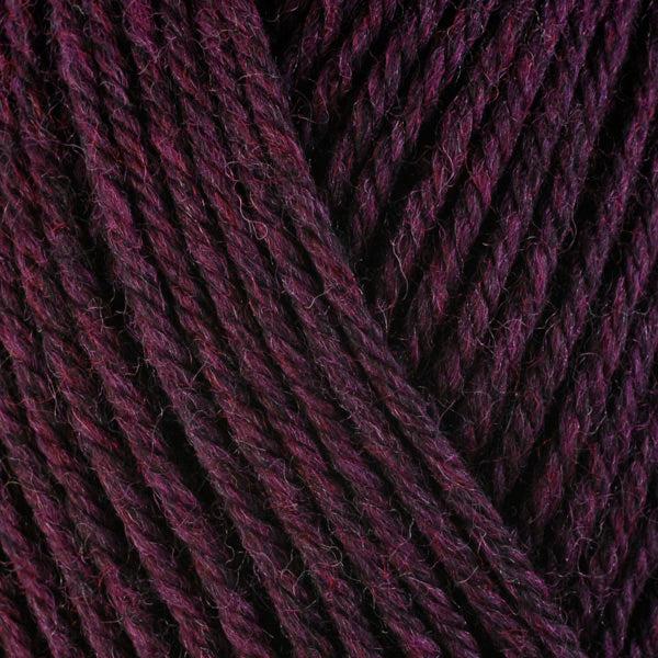 Detail of Berroco Ultra Wool Hollyhock 33159, a dark heathered maroon. 