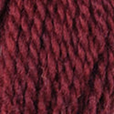 Detail of Blue Sky Woolstok 50g cranberry compote, a bright dark crimson red. 