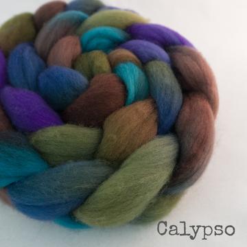 Detail of Greenwood Fiberworks Pigtails Calypso in gemstone colors of green, blue, purple and pink.
