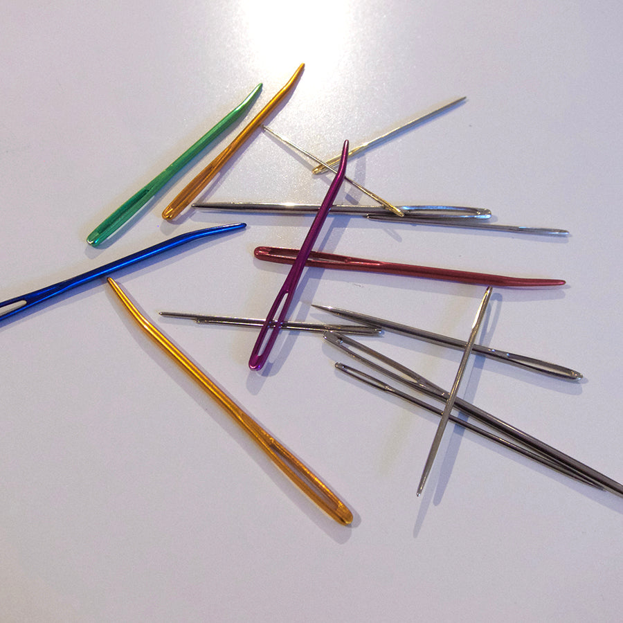 Image of various darning needles in different sizes and colors.