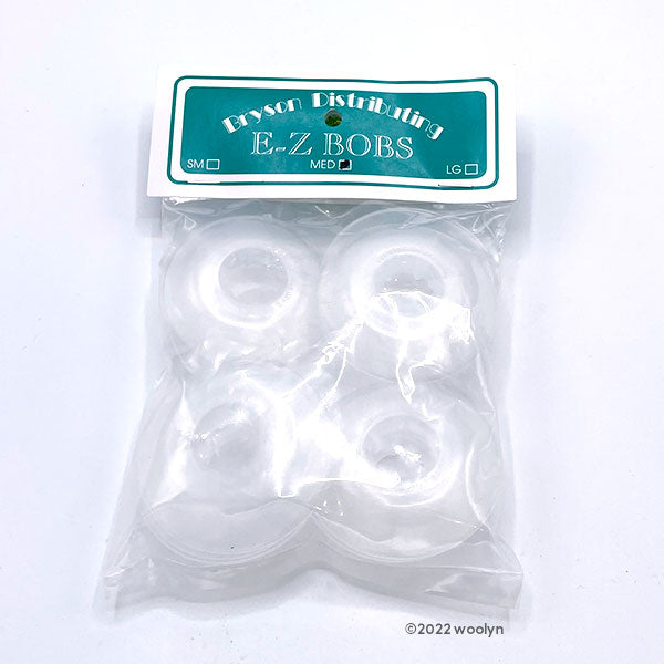 Flexible plastic bobbins for winding yarn onto. 