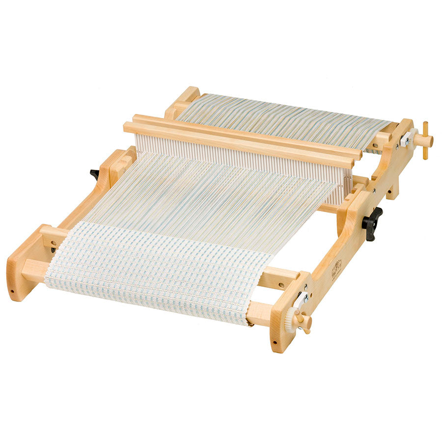 Image of a Schacht Flip Loom open with two heddles.