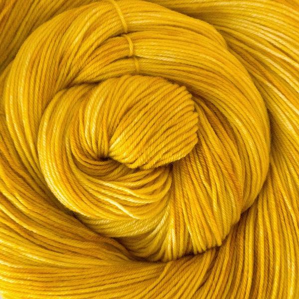 Detail of Greenwood Fiberworks Simply Sock Canary Tonal a medium warm yellow.