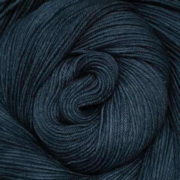 Detail of Greenwood Fiberworks Simply Sock Denim Semi, in a dark grey blue.  