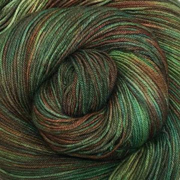 Detail of Greenwood Fiberworks Simply Sock Mallard, a variegated yarn in shades of dark green and brown. 