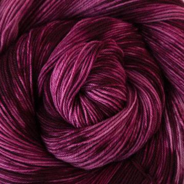 Detail of Greenwood Fiberworks Simply Sock Mulberry Tonal in variegated pink and maroon. 