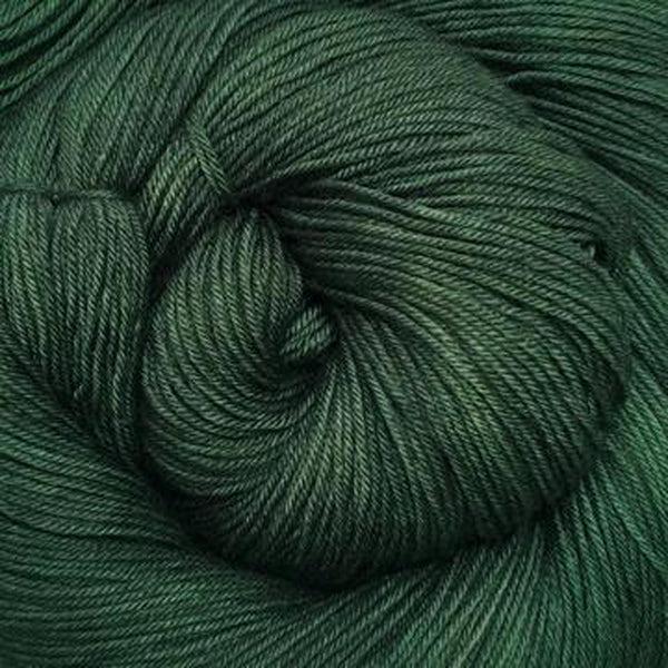 Detail of Greenwood Fiberworks Simply Sock Pine Semi, a deep, dark green.