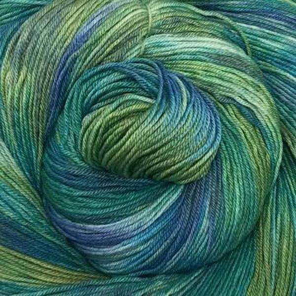 Detail of Greenwood Fiberworks Simply Sock Seaglass, a variegated yarn in shades of yellowy green and blue.