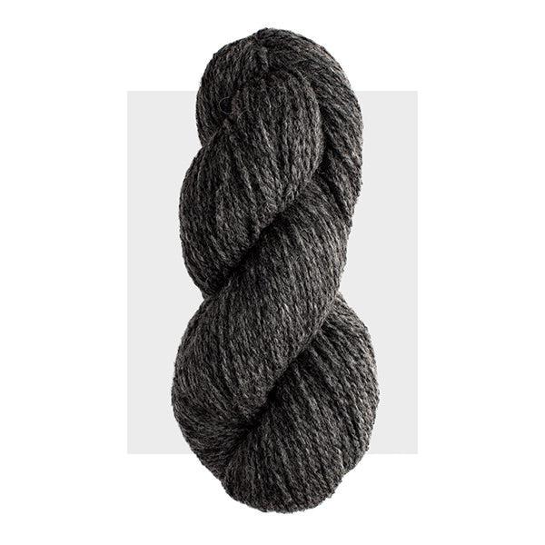 Skein of Harrisville Highland Charcoal, a dark cool grey heathered with lighter grey.