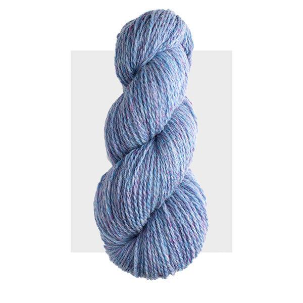 Skein of Harrisville Highland Cornflower, a bright, light blue heathered with lavender.