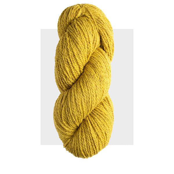 Skein of Harrisville Highland Goldenrod, a cool yellow heathered with darker tones.