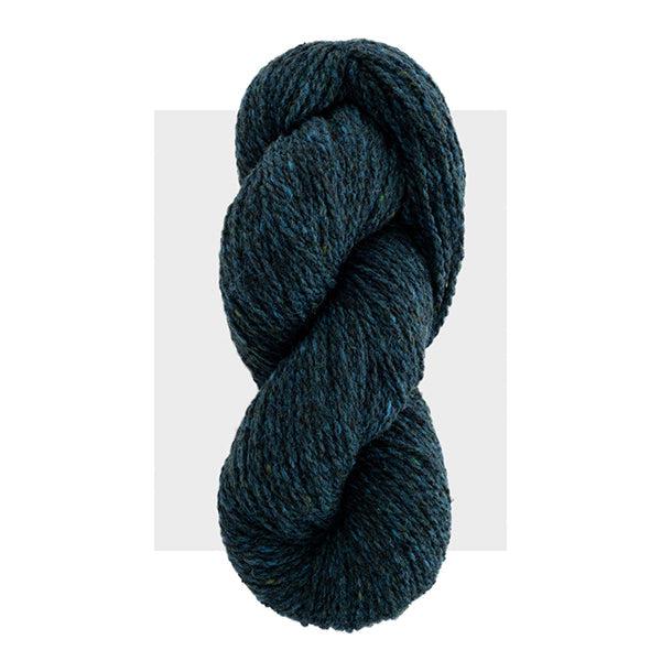 Skein of Harrisville Highland Loden Blue, a dark grey blue heathered with lighter blue.