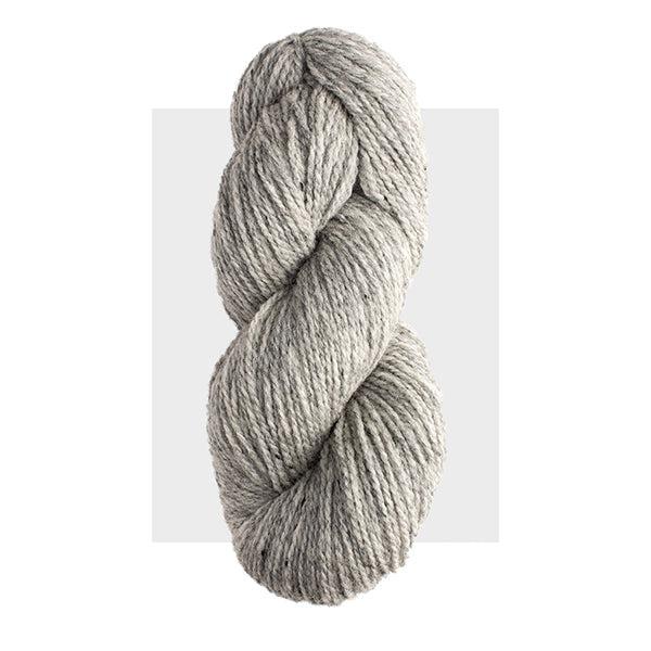 Skein of Harrisville Highland Silver Mist, a medium cool grey heathered with slightly darker grey.