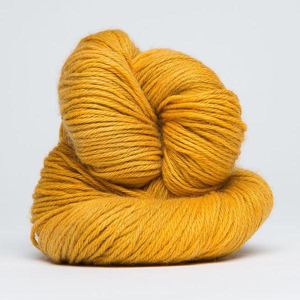Skein of Jade Sapphire 4Ply Golden Amber 67, a warm yellow.