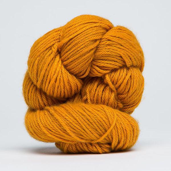 Skein of Jade Sapphire 4Ply Masala 107, a warm golden orange. 