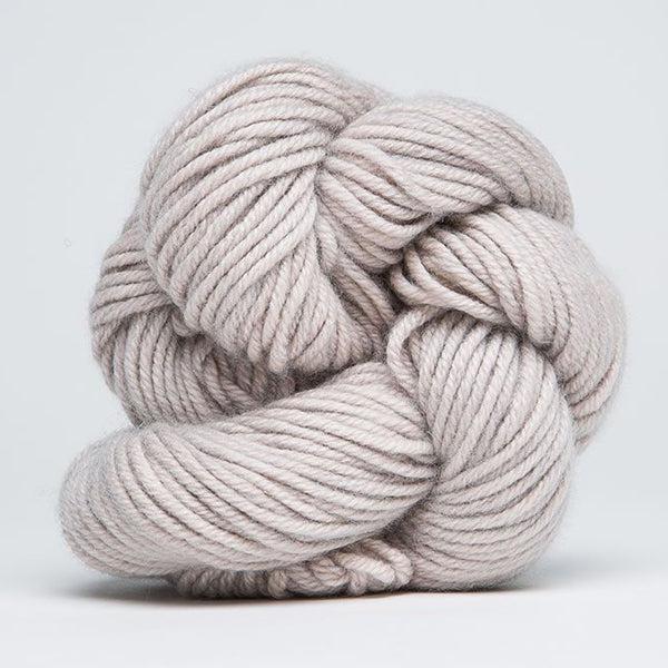 Skein of Jade Sapphire 4Ply Pebble Beach 23, a pale warm grey.