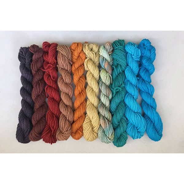 10 mini skeins of Jade Sapphire Coloring Box Su Casa-and pattern booklet in vibrant shades of brown, orange, yellow and turquoise.