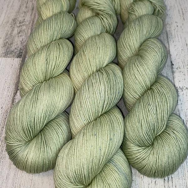 Skeins of JEMS Monster Minis Peridot, a sage green.