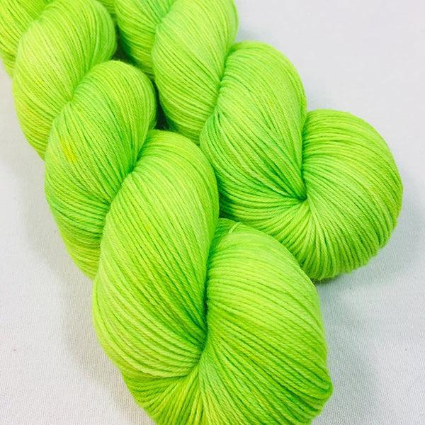 Skeins of JEMS Monster Minis Serpentine, a bright fluorescent yellow green. 