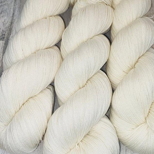 Skeins of JEMS Monstrous Pearl, an undyed off white.