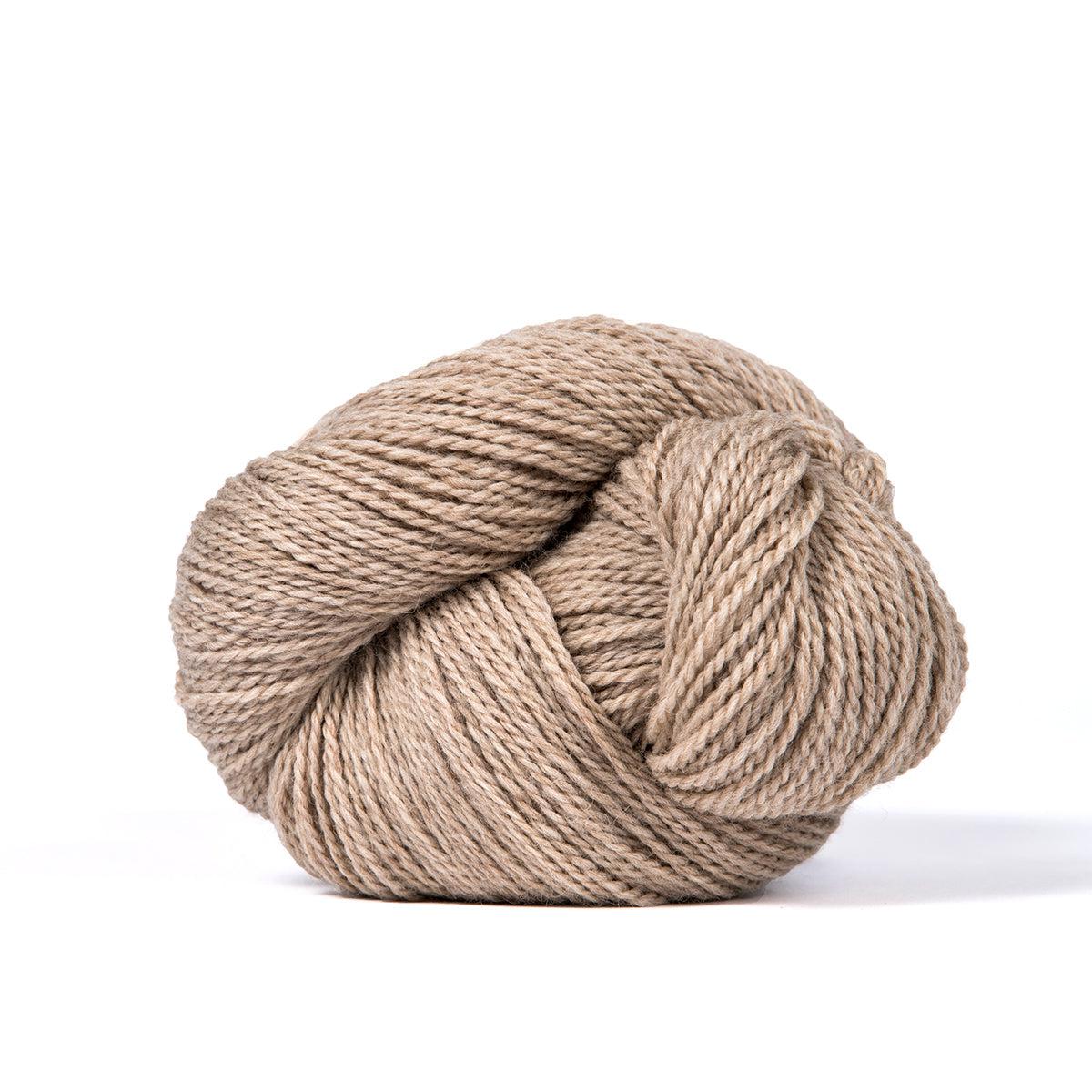 A skein of Kelbourne Woolens Camper Oatmeal Heather 278, a heathered tan.