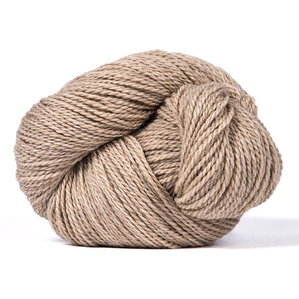 A skein of Kelbourne Woolens Scout Oatmeal Heather 278, a heathered light tan.