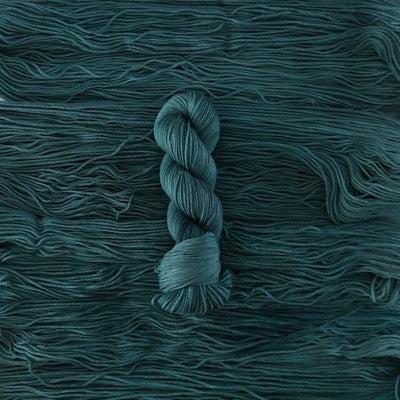 Detail of Knerd String 4ply Fingering Rhymes w/ Seal a deep teal color.