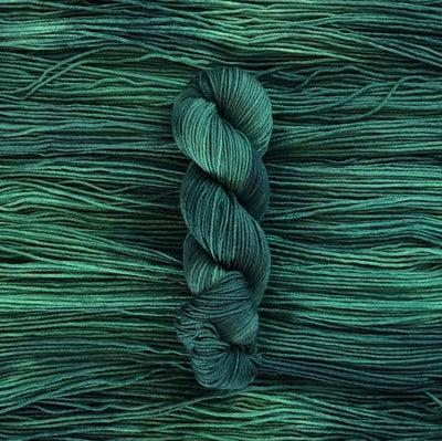 Detail of Knerd String SW Worsted Muir a pale to medium green color. 