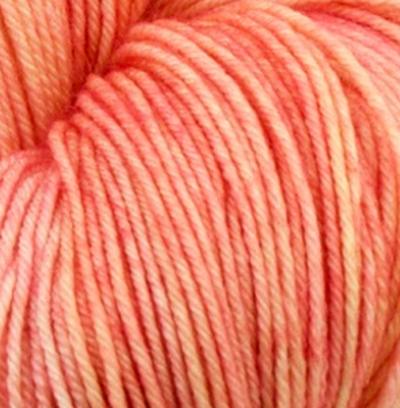 Detail of Knerd String SW Worsted Tang a bright salmon pink orange color.