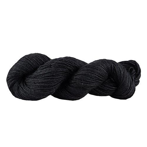 A skein of Manos Silk Blend Black 3008, a black yarn.