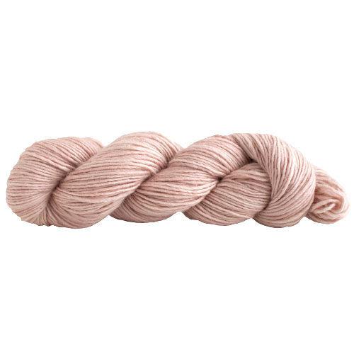 A skein of Manos Silk Blend Cameo 3052, a shell pink.