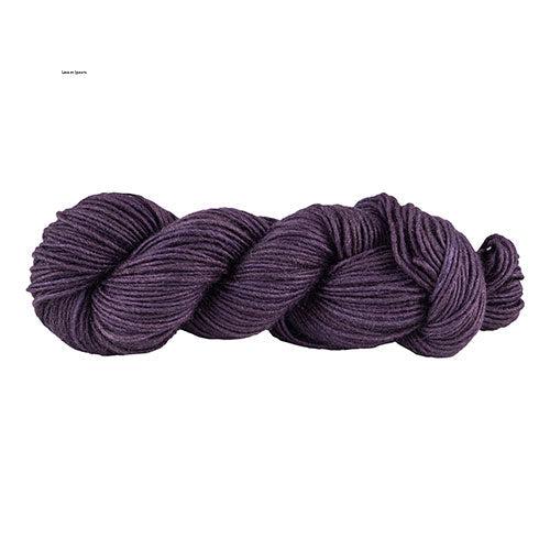 A skein of Manos Silk Blend Sea Urchin 3239, a dark purple.