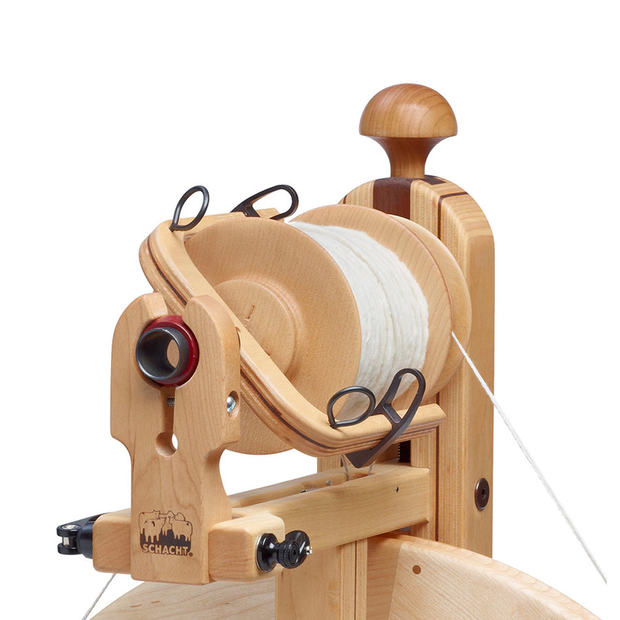 Picture of a Schacht Bulky Flyer Package includes: a generously sized 7/8″ orifice, large-capacity bobbins (about 8 ounces), sliding flyer hooks and large round guide hooks.