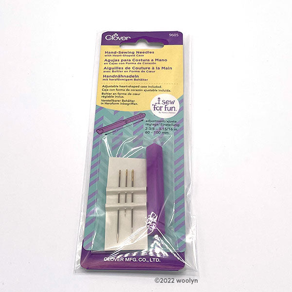 3 different sewing/embroidery needles with a heart-shaped case.