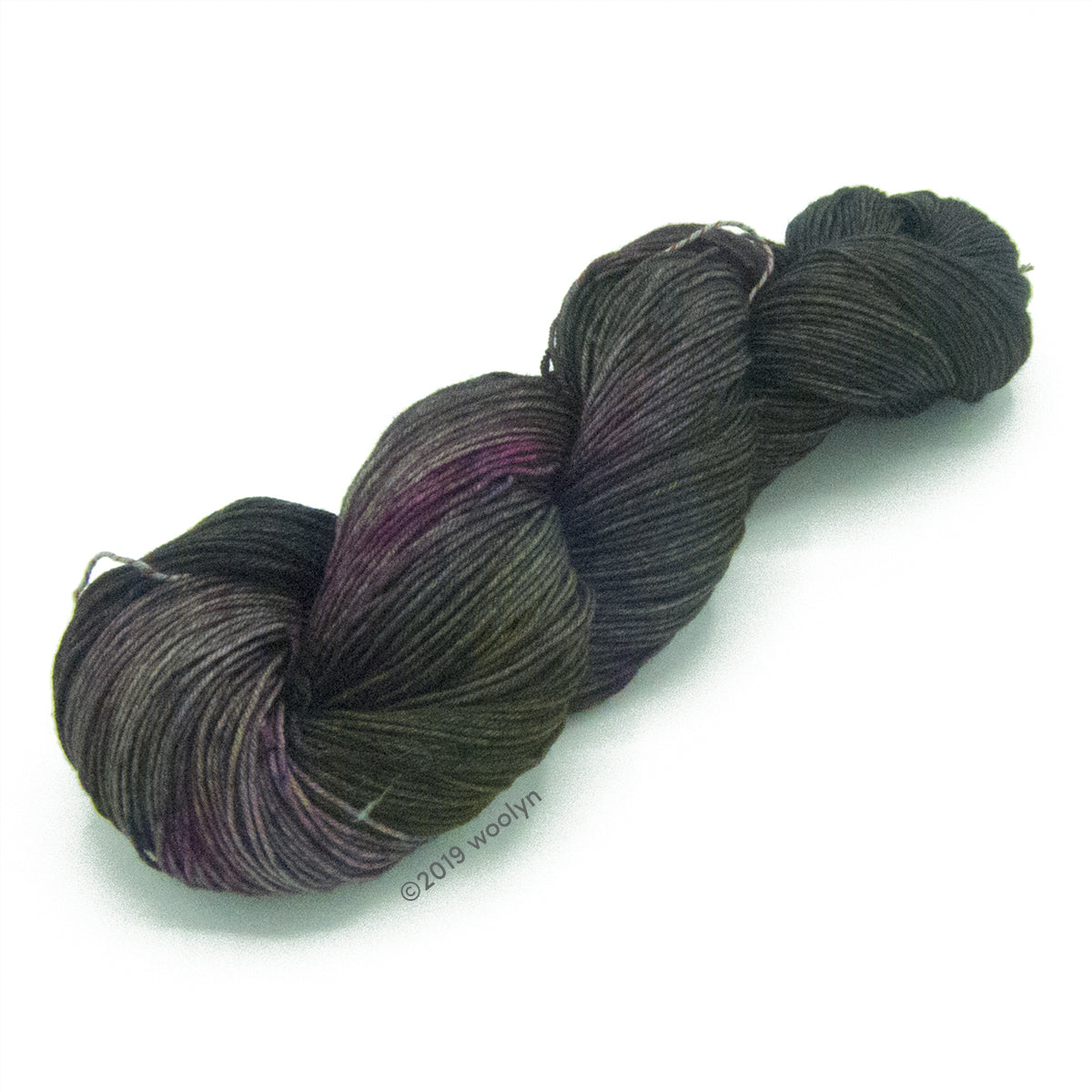 Molly Girl Bouncer in exclusive shop colorway No Sleep 'Til Brooklyn a grey black with a hint of maroon. This yarn glows under a black light. 