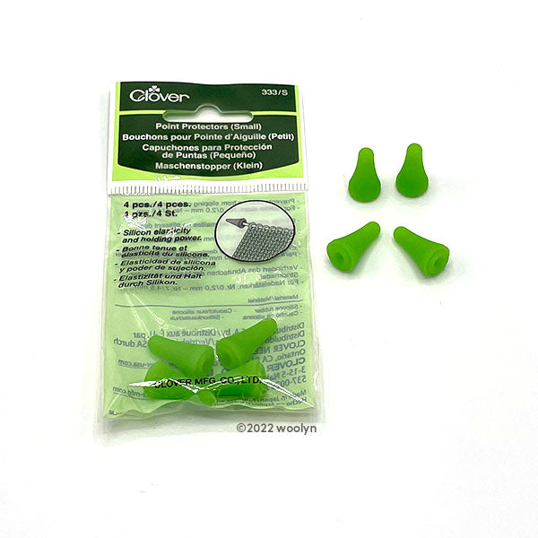 Small point protectors in green. Four pieces per set.