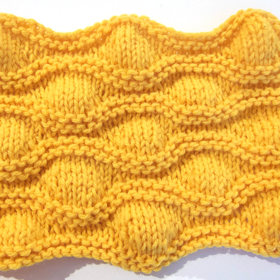 Image of knitted short row shaping sample in yellow color. 
