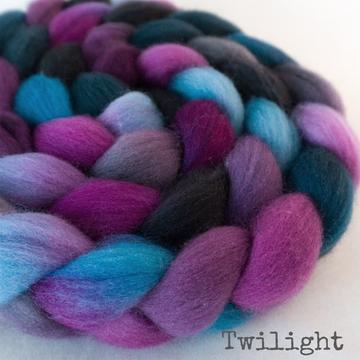 Detail of Greenwood Fiberworks Falkland Twilight, in purples, bright blue and black. 